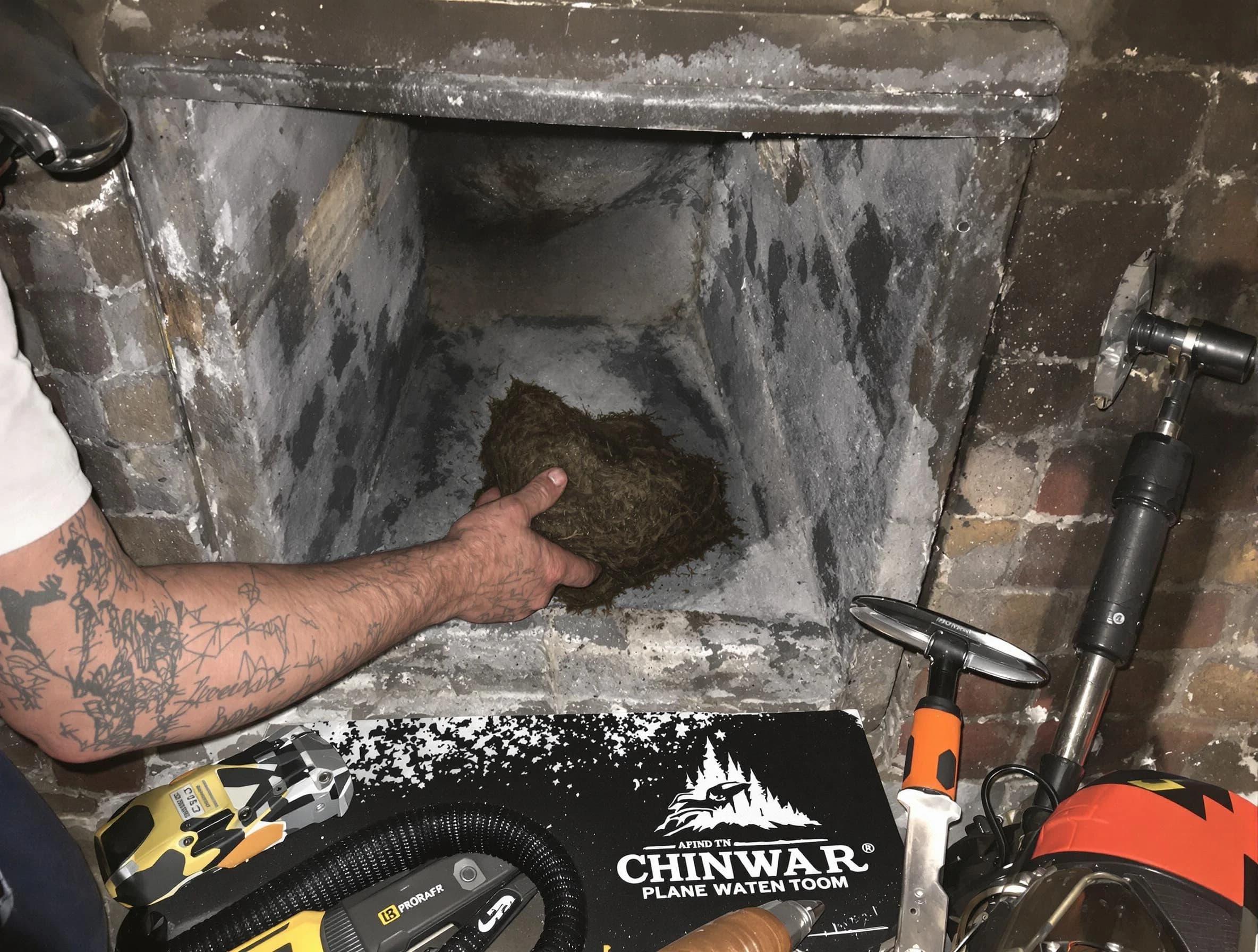 Medford Chimney Sweep safely removing debris and screening chimney in Medford, MA